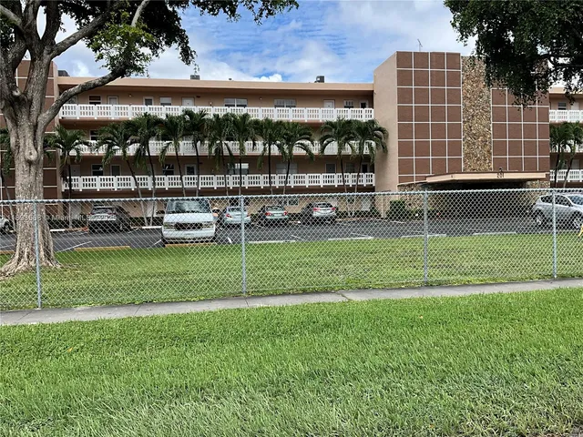 a front view of a building with garden