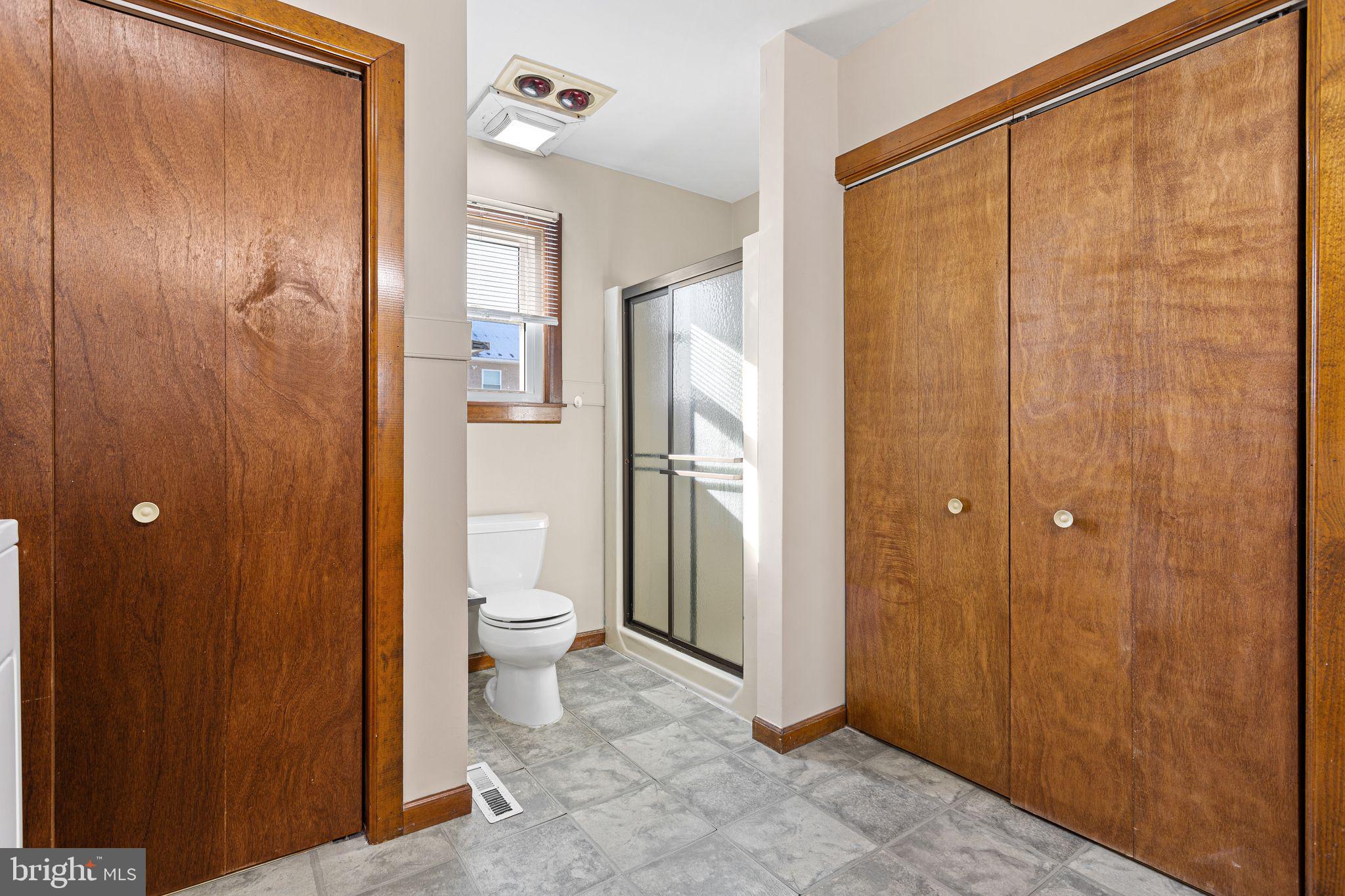 2623 Knights Road Bensalem, PA 19020 - Photo 27 of 50 a bathroom with a glass shower door