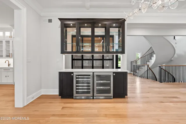 a view of kitchen with entryway and wooden floor