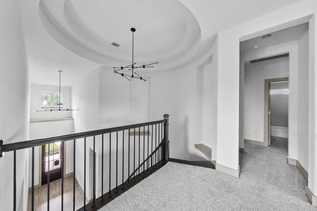 a view of a hallway view with staircase