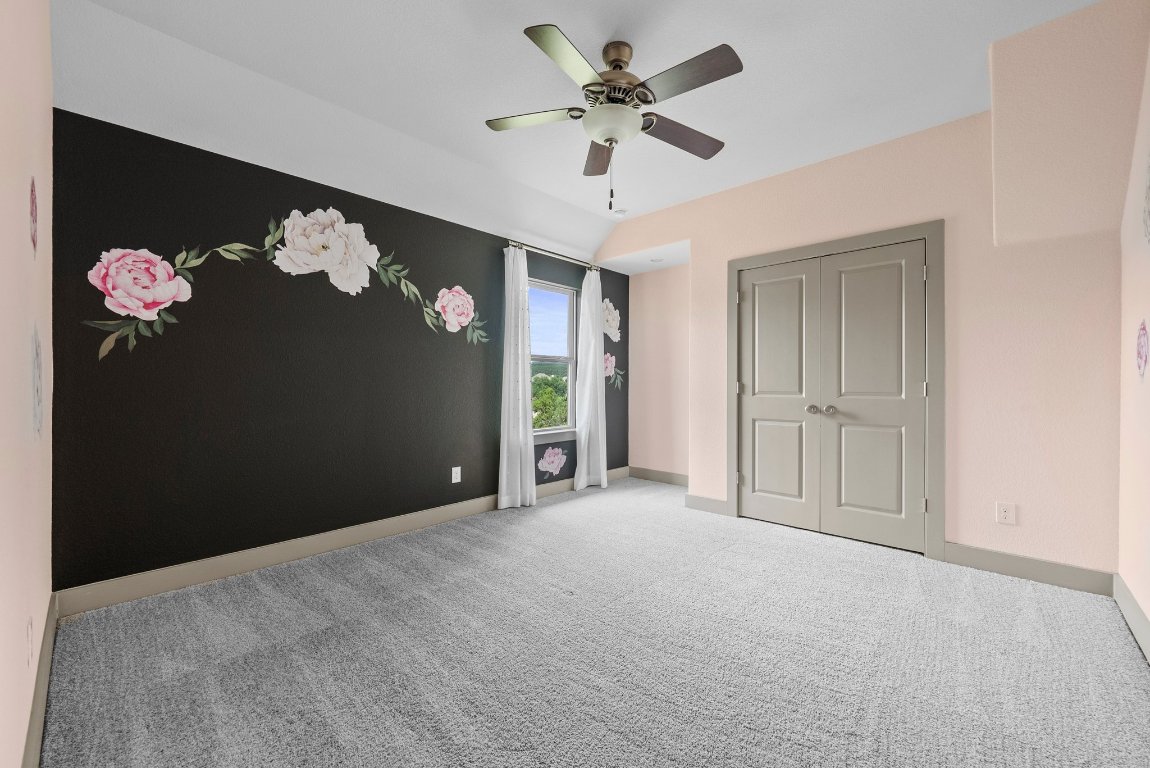 8108 Turning Leaf Circle Lago Vista, TX 78645 - Photo 26 of 40 Charming and cheerful with floral wall accents and a peaceful Hill Country view right out the window.