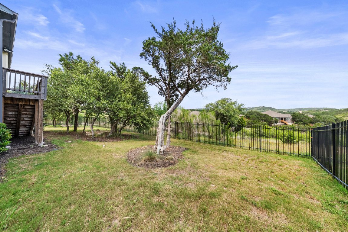 8108 Turning Leaf Circle Lago Vista, TX 78645 - Photo 37 of 40 Established trees, native landscaping, and plenty of space to explore or relax out back.