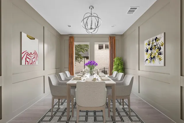 a view of a dining room with furniture wooden floor and a chandelier