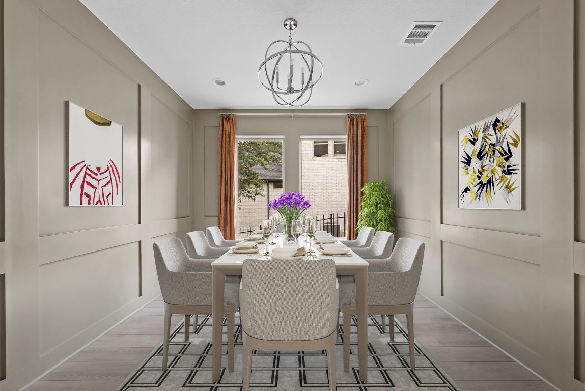 8108 Turning Leaf Circle Lago Vista, TX 78645 - Photo 5 of 40 A show-stopping dining room with designer paneling, modern lighting, and room to gather in style. - Virtually Enhanced