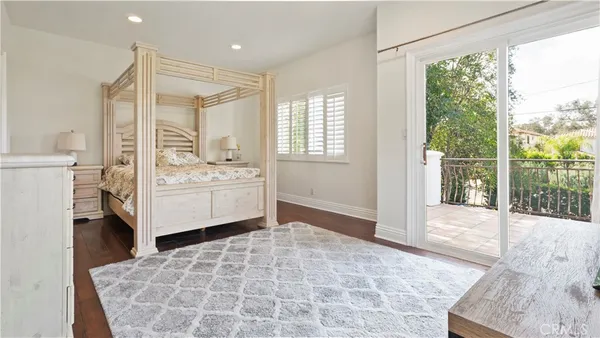 a en suite bathroom with a tub mirror and window