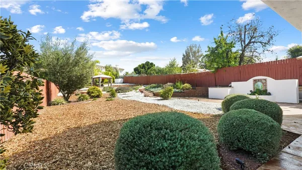 a view of a backyard of the house