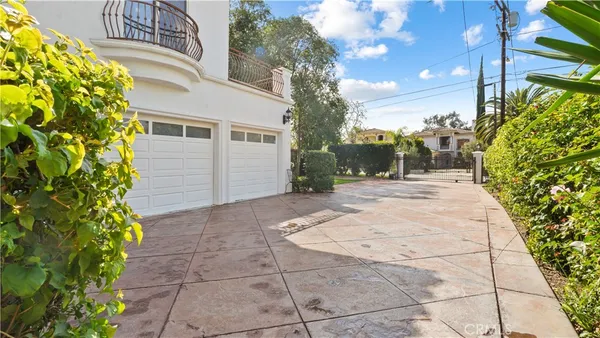 a backyard of a house with plants and trees