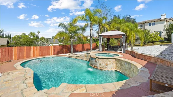 a view of a swimming pool with a patio