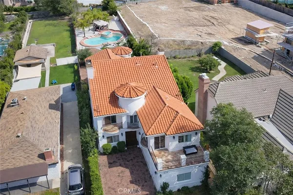 an aerial view of a house with outdoor space