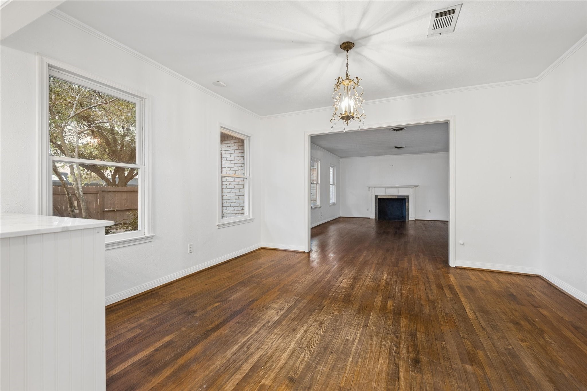 1931 Bissonnet Street Houston, TX 77005 - Photo 10 of 22 a view of empty room with wooden floor and fan