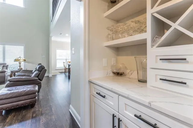 a hallway with a view of living room