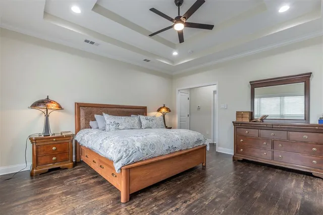 a bedroom with a bed and a dresser