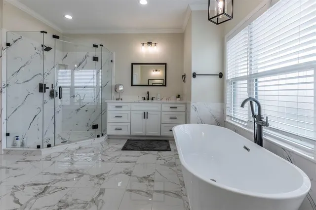 a spacious bathroom with a bathtub sink and toilet