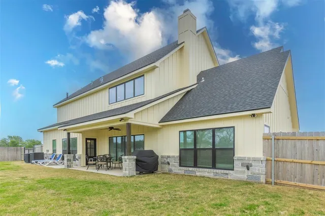 a front view of house with outdoor seating