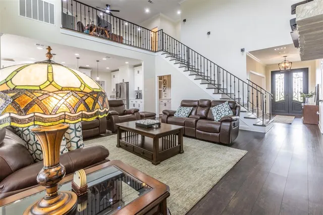 a living room with fireplace furniture and a wooden floor