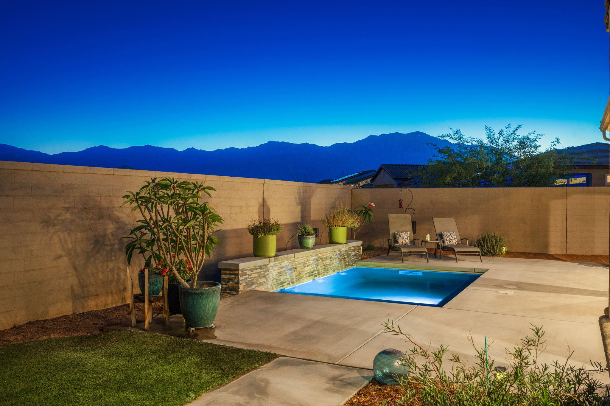 a view of outdoor space with seating area and city view