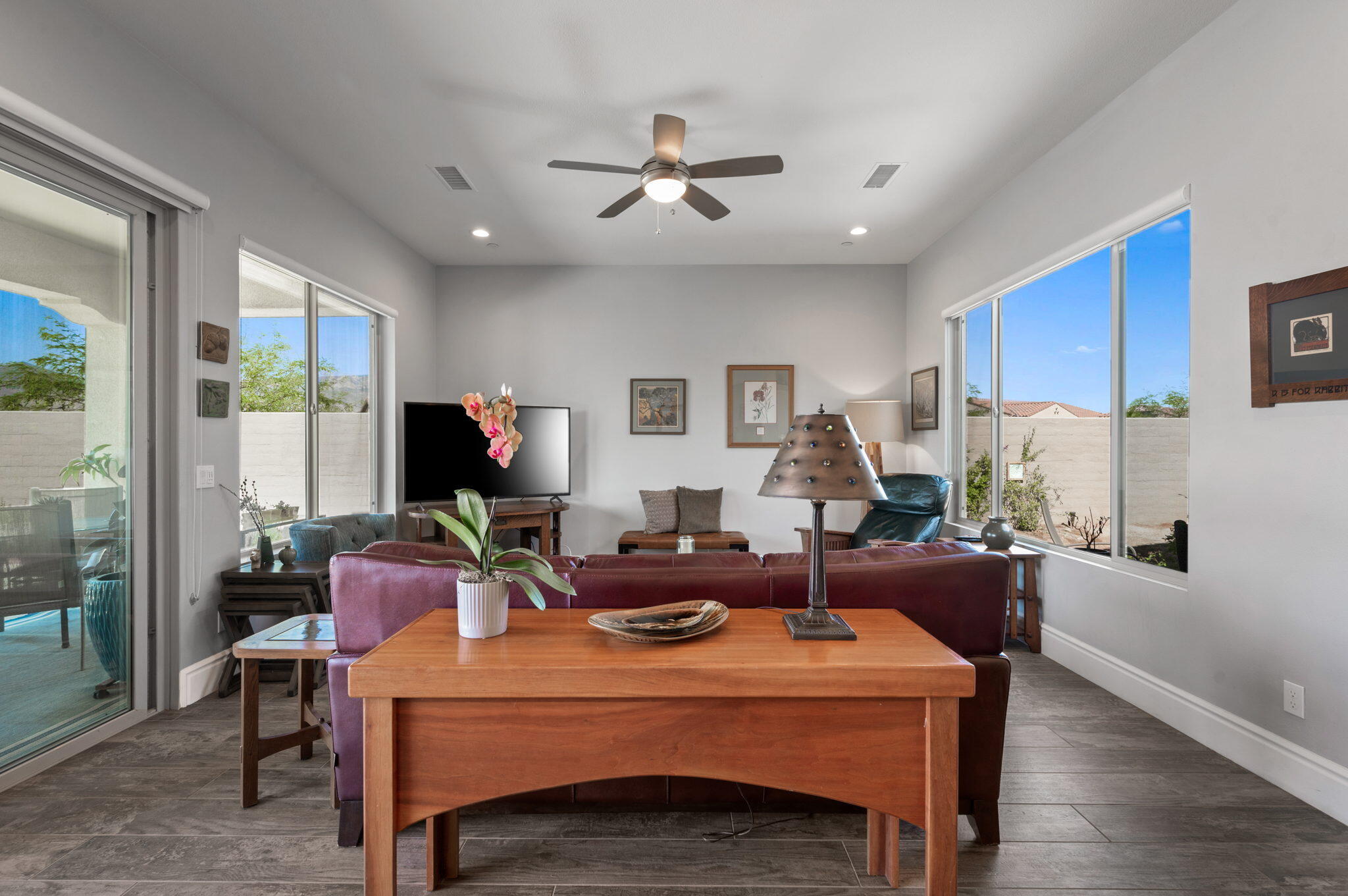49 Cabernet Rancho Mirage, CA 92270 - Photo 16 of 40 a living room with furniture a flat screen tv and a large window
