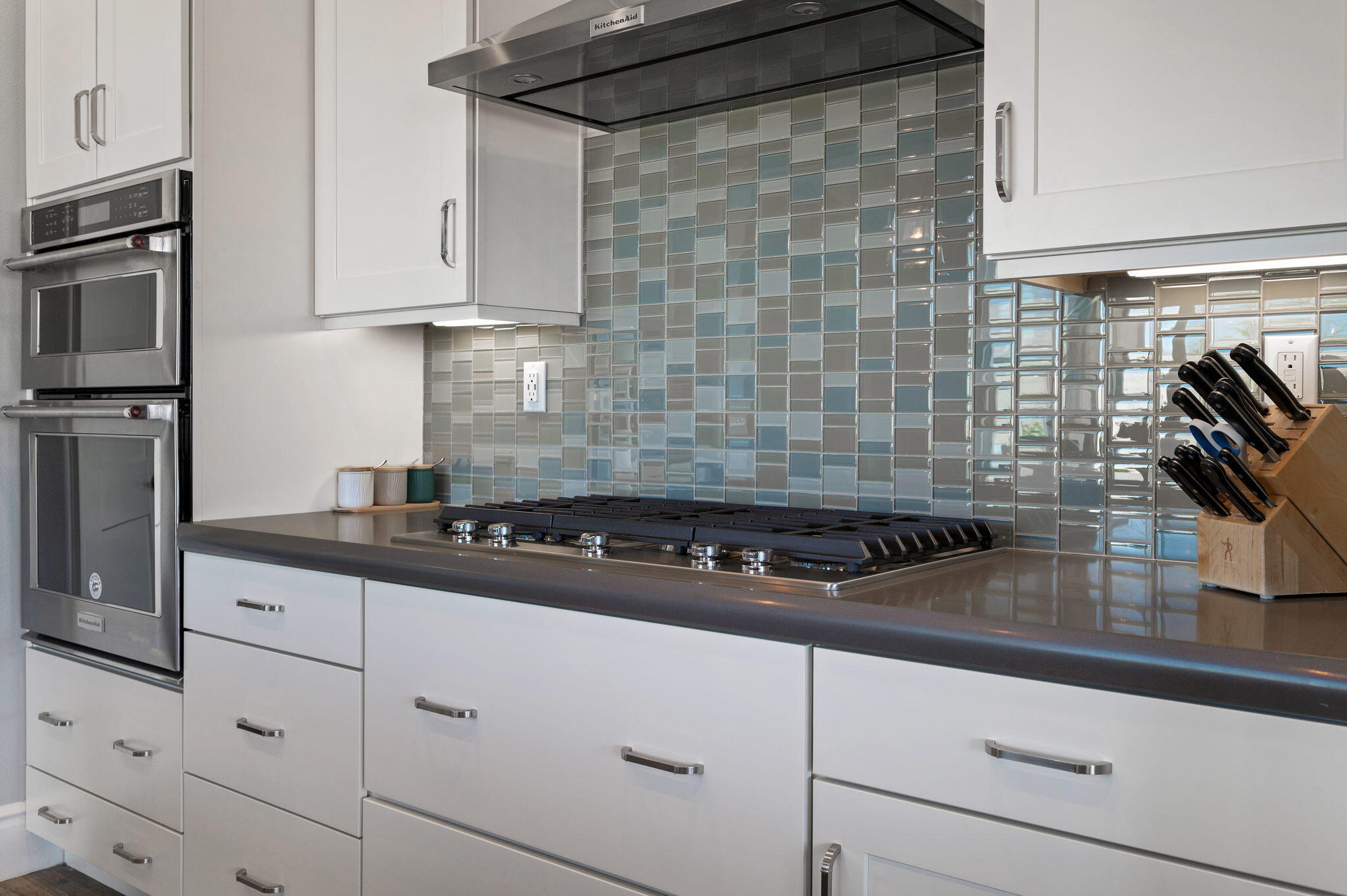 49 Cabernet Rancho Mirage, CA 92270 - Photo 17 of 40 a kitchen with white cabinets and appliances