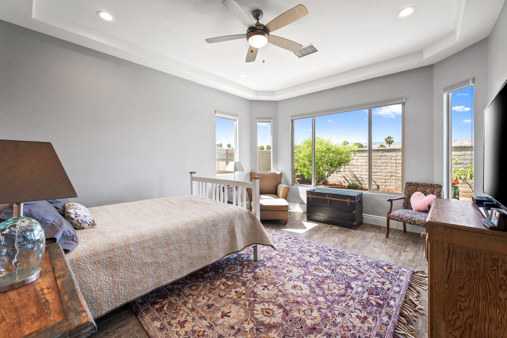 49 Cabernet Rancho Mirage, CA 92270 - Photo 24 of 40 a bedroom with a bed and a couch