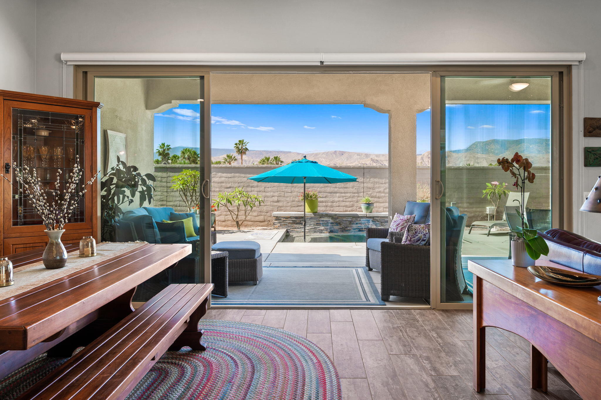49 Cabernet Rancho Mirage, CA 92270 - Photo 30 of 40 a living room with furniture a flat screen tv and floor to ceiling window