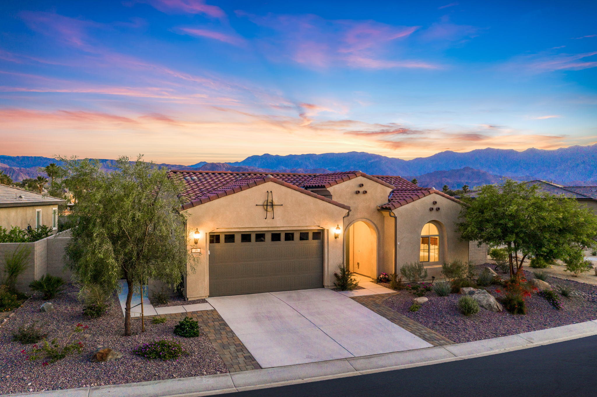 49 Cabernet Rancho Mirage, CA 92270 - Photo 34 of 40 a front view of a house with a yard