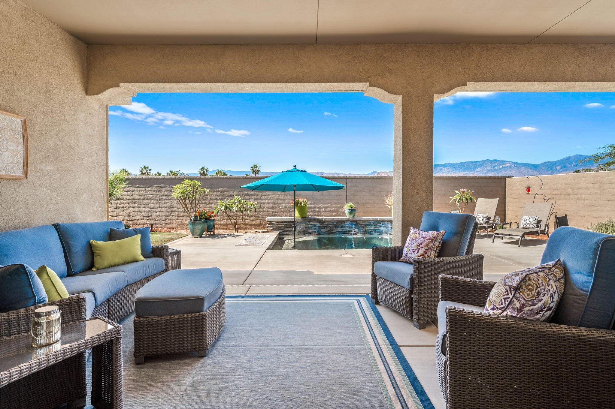 49 Cabernet Rancho Mirage, CA 92270 - Photo 37 of 40 a living room with furniture and a floor to ceiling window