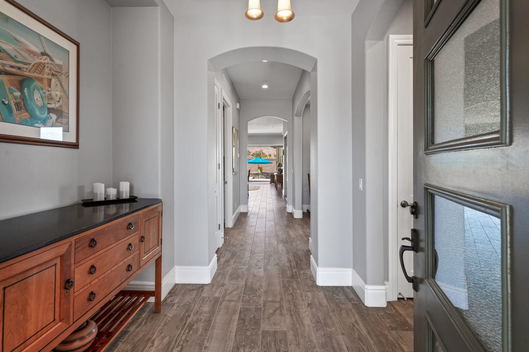 49 Cabernet Rancho Mirage, CA 92270 - Photo 9 of 40 a view of a hallway with wooden floor and staircase
