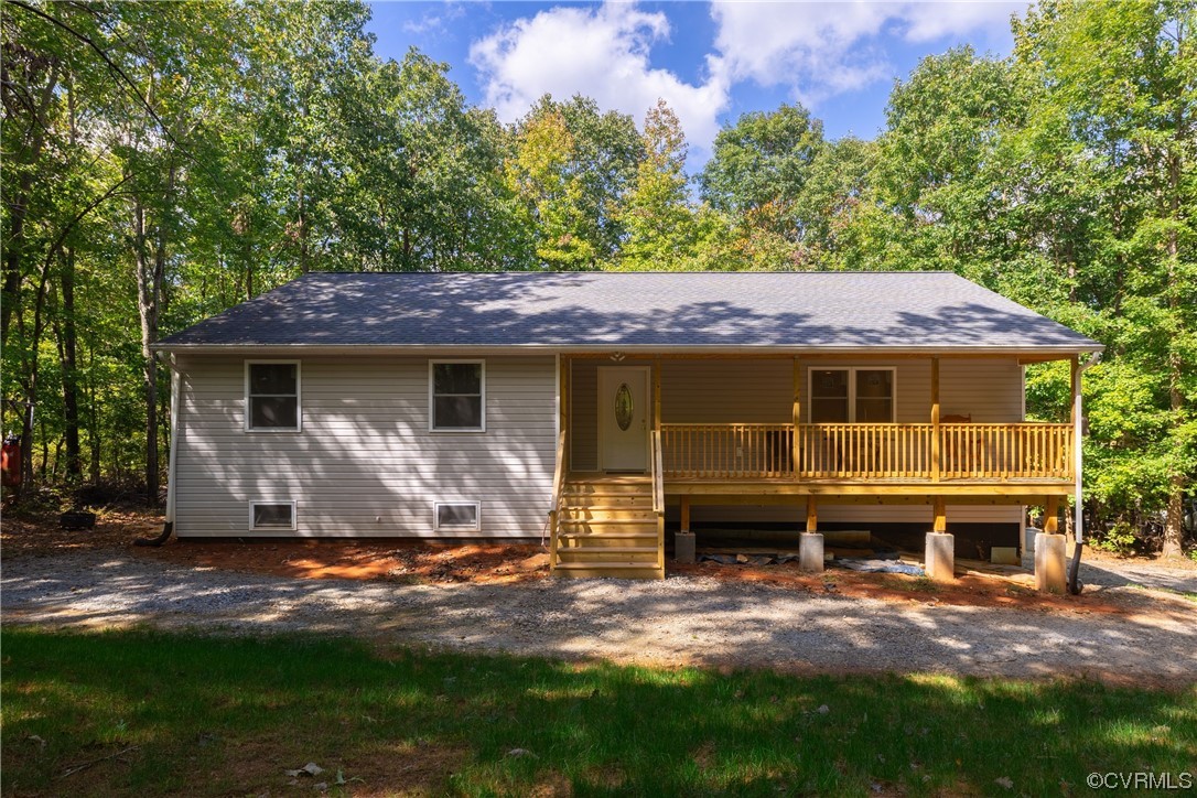 363 Oak Hill Road Prospect, VA 23960 - Photo 1 of 33 a front view of a house with a garden