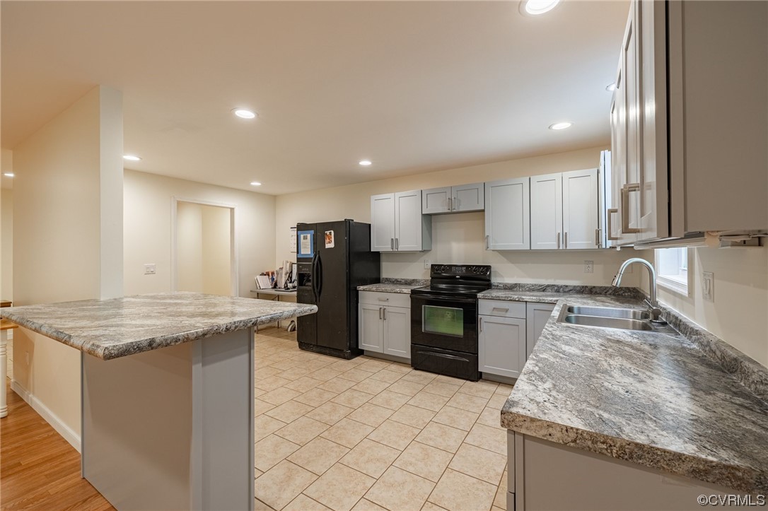 363 Oak Hill Road Prospect, VA 23960 - Photo 11 of 33 a kitchen with a stove a sink and a refrigerator