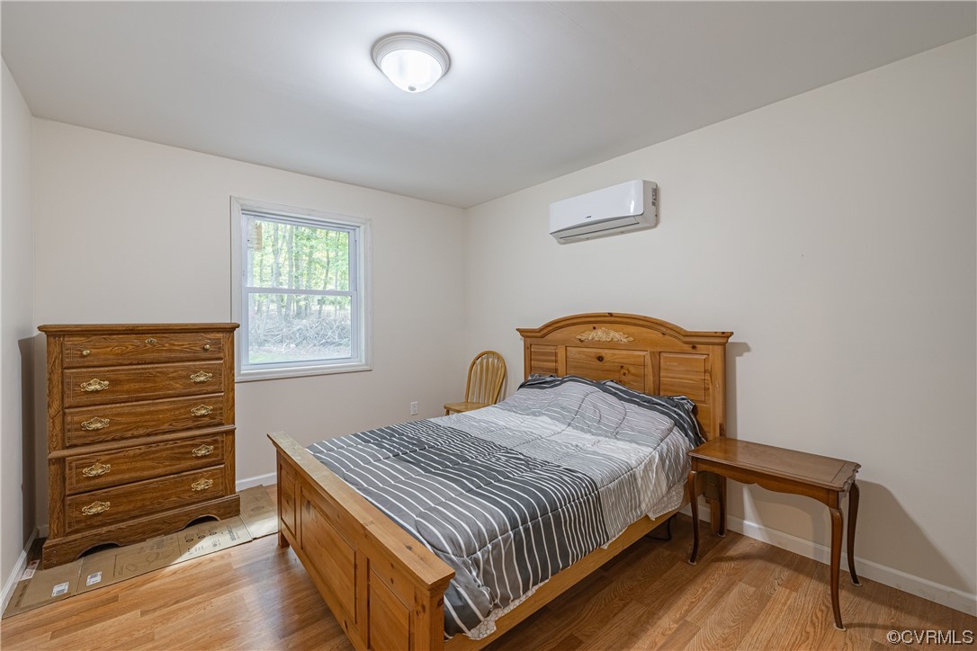 363 Oak Hill Road Prospect, VA 23960 - Photo 17 of 33 a bedroom with a bed and a window