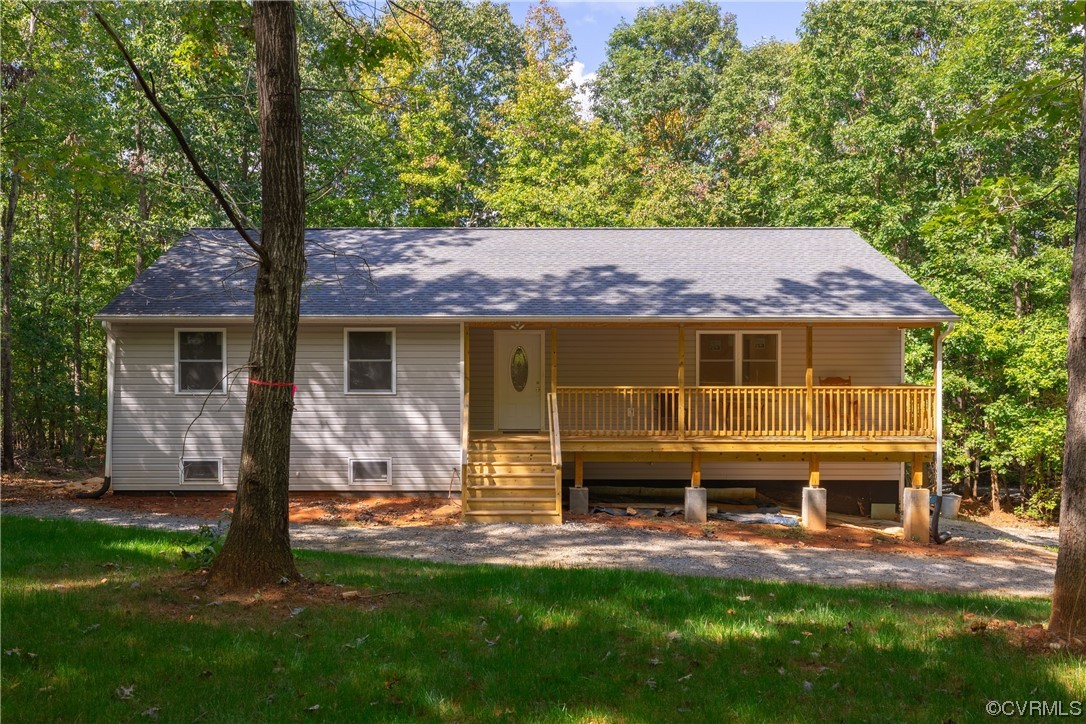 363 Oak Hill Road Prospect, VA 23960 - Photo 25 of 33 a front view of a house with a yard table and chairs