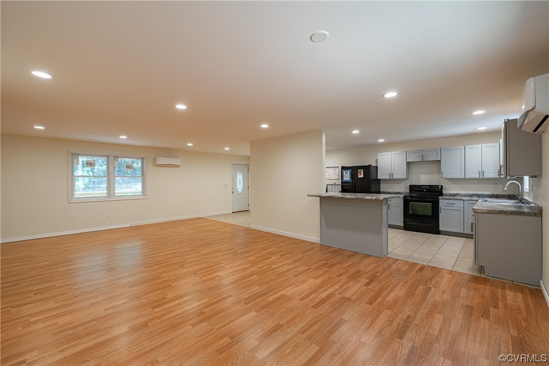 363 Oak Hill Road Prospect, VA 23960 - Photo 7 of 33 a view of kitchen with wooden floor and large window