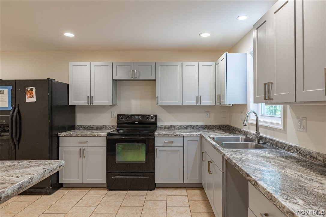 363 Oak Hill Road Prospect, VA 23960 - Photo 9 of 33 a kitchen with a stove sink and refrigerator