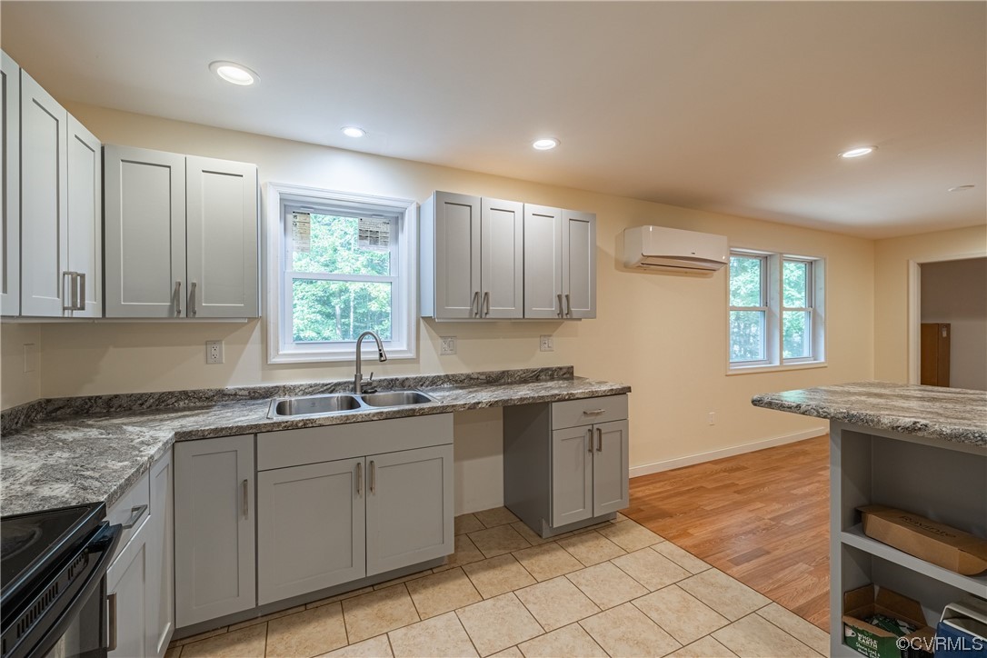 363 Oak Hill Road Prospect, VA 23960 - Photo 10 of 33 a kitchen with a sink window and cabinets