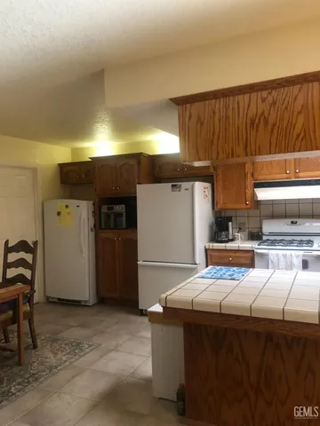 a kitchen with a sink and a refrigerator