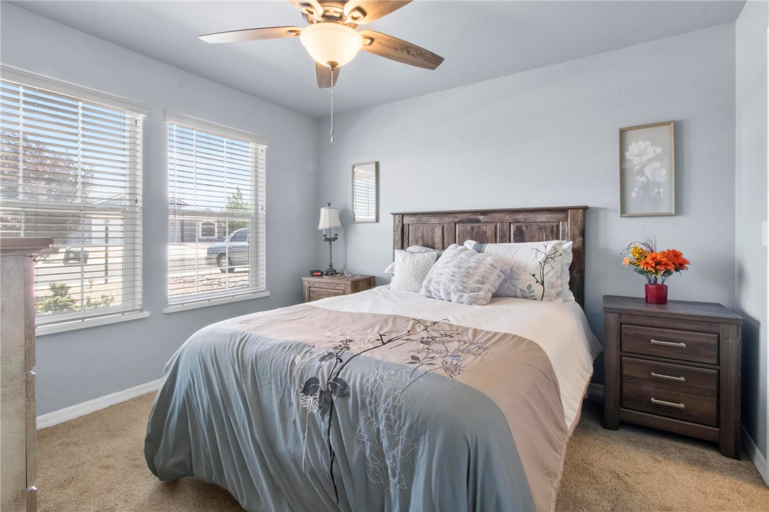 3897 Easy Street Kingman, AZ 86409 - Photo 25 of 53 a bedroom with a bed and a chandelier