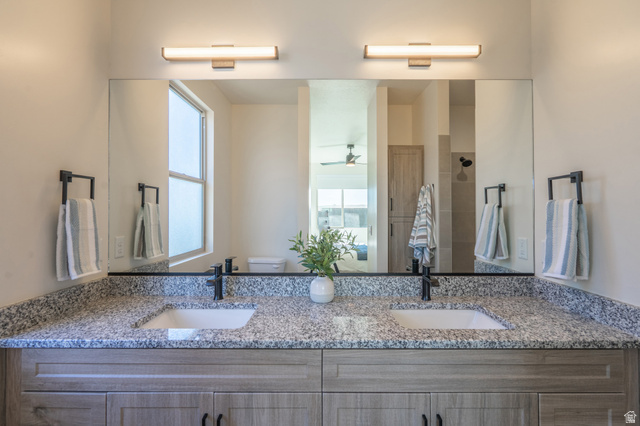 2972 West 570 North Hurricane, UT 84737 - Photo 52 of 104 Bathroom with double vanity, walk in shower, and ceiling fan