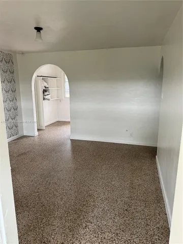 a view of wooden floor and entryway