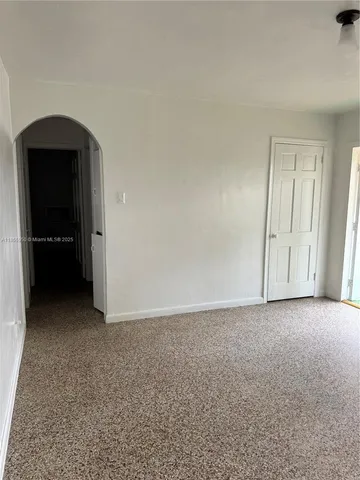 a view of empty room with windows