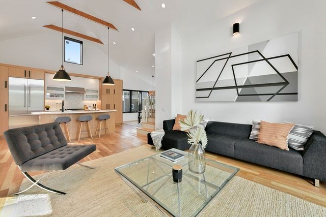 a living room with furniture and a rug