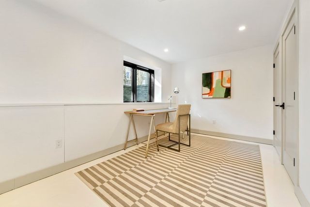 a workspace with furniture and a window