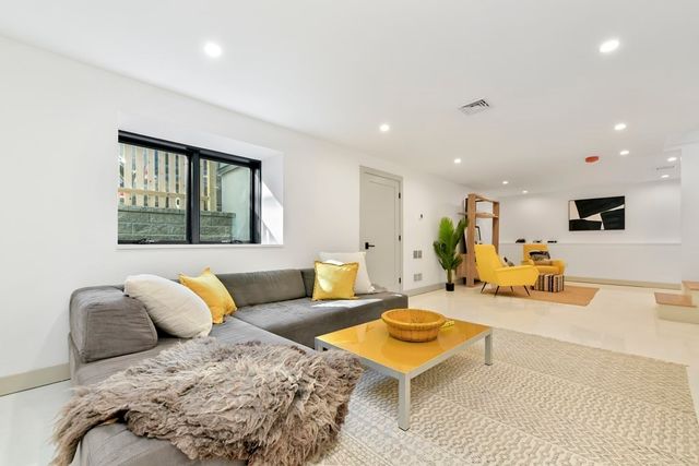 a living room with furniture and a couch