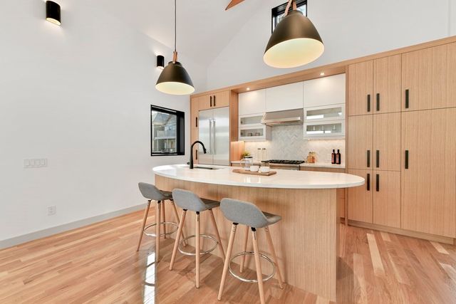 a kitchen with a table and chairs