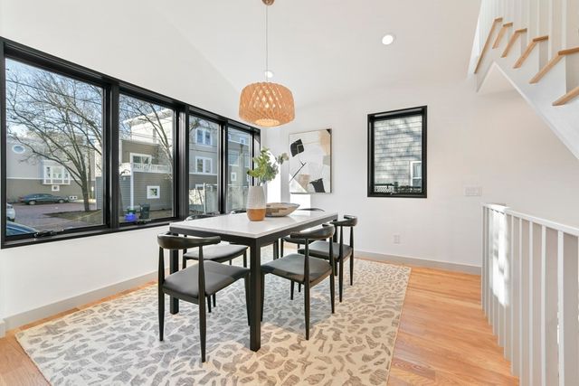 a view of a a dining room with a table and chairs