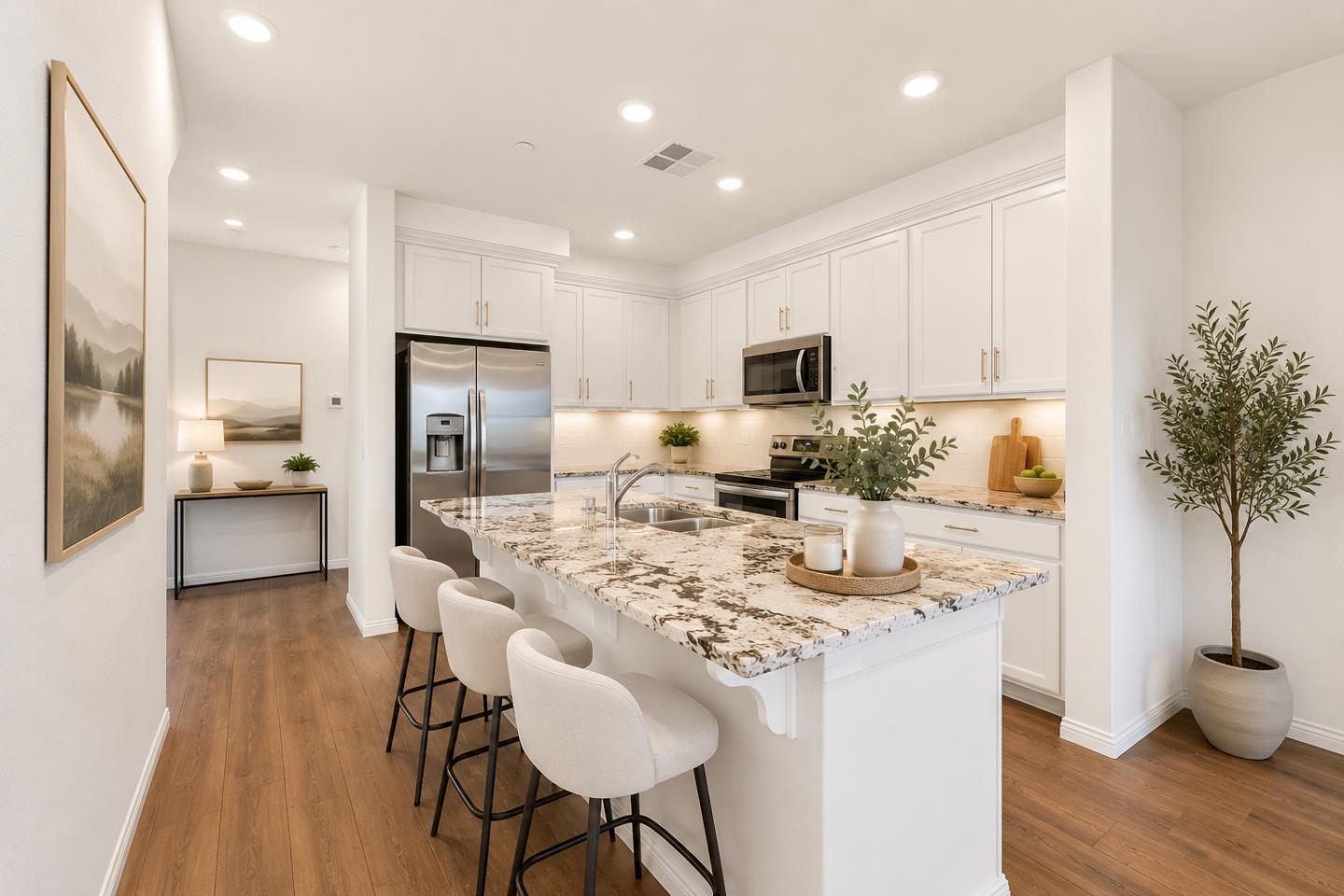 2580 Gimelli Way San Jose, CA 95133 - Photo 5 of 16 a kitchen with stainless steel appliances kitchen island granite countertop a refrigerator a stove a sink a dining table and chairs with wooden floor