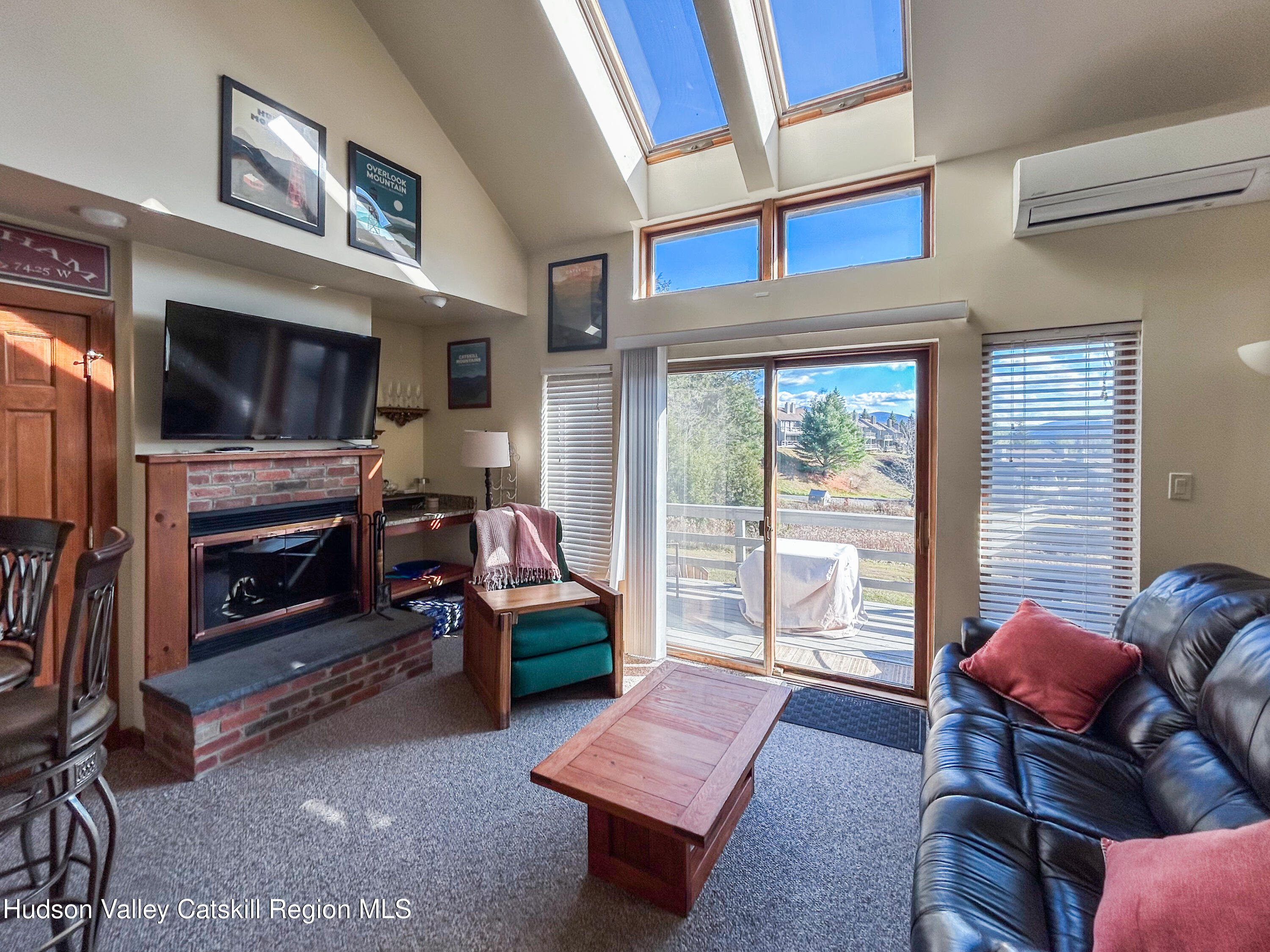 113 Windham Ridge Road Windham, NY 12496 - Photo 15 of 43 a living room with furniture and a flat screen tv