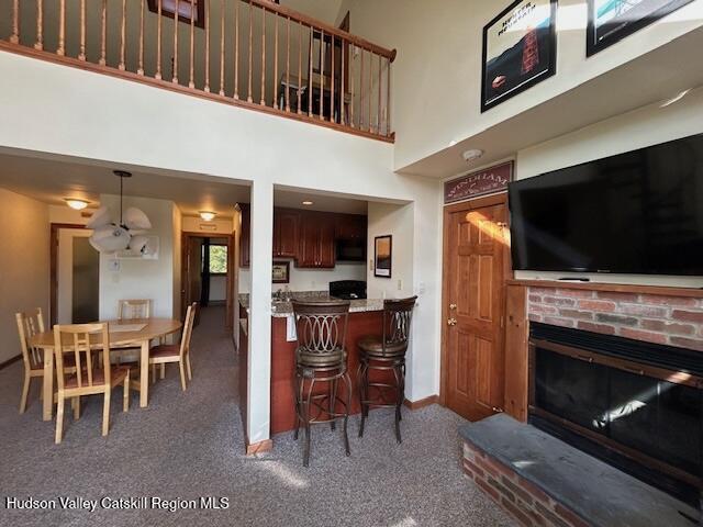 113 Windham Ridge Road Windham, NY 12496 - Photo 17 of 52 a living room with stainless steel appliances furniture a fireplace and a flat screen tv