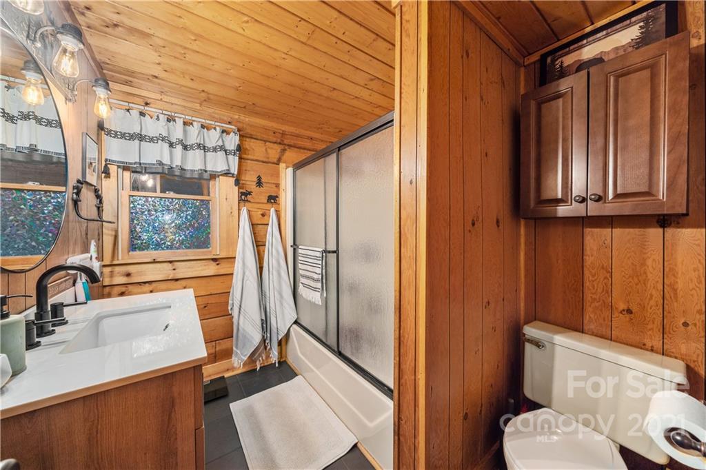 146 Spring Drive Maggie Valley, NC 28751 - Photo 16 of 36 a bathroom with a sink toilet and shower