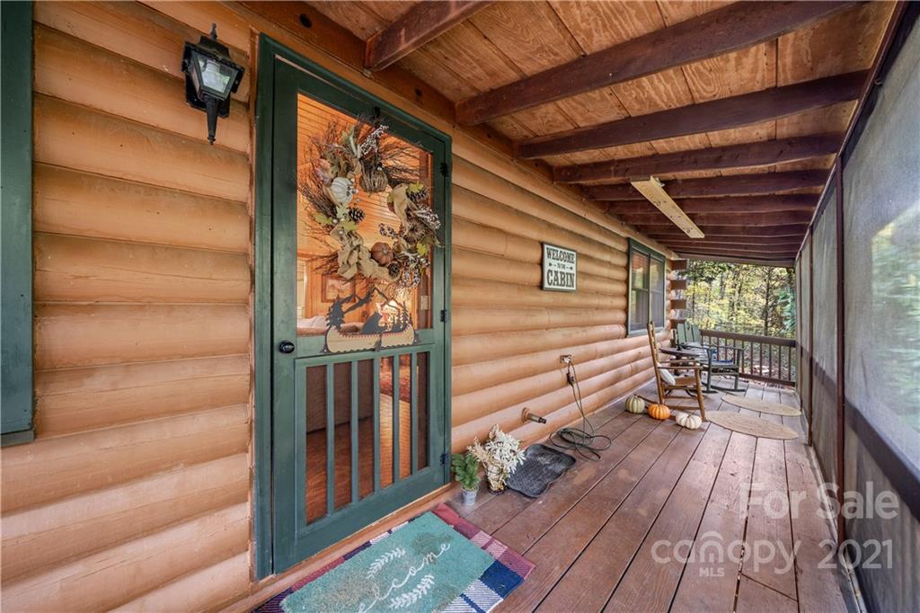 146 Spring Drive Maggie Valley, NC 28751 - Photo 17 of 36 a balcony with wooden floor
