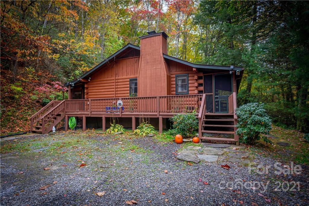 146 Spring Drive Maggie Valley, NC 28751 - Photo 2 of 36 a view of a house with a yard